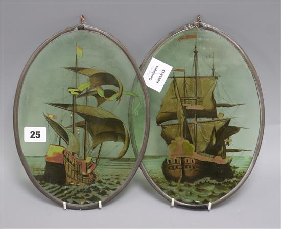 A pair of 19th century Spanish glass panels, painted with galleons, framed to the oval